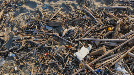 The problem of trash on the beach caused by man-made pollution and environmental in concept