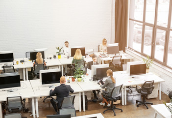 Young people working in modern office