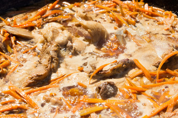 preparation of a national dish pilaf Uzbek people in the outbreak