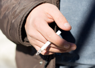 cigarettes in close-up hands