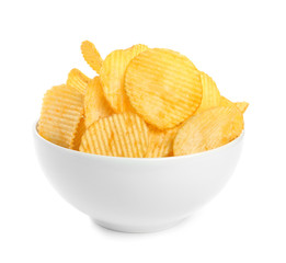 Bowl of tasty ridged potato chips on white background