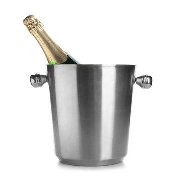 Bottle of champagne in bucket on white background