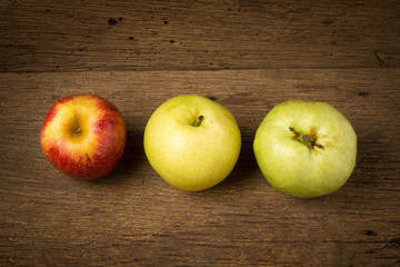 fruit traffic light concept. apple red. chinese pear yellow. guava green. on old wood