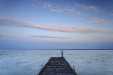 Tranquil nature calm sea water with jetty in north Poland, Baltic beach on Hel peninsula