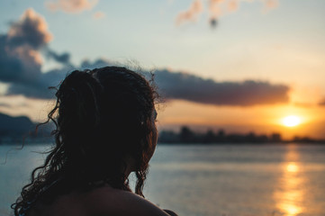 silhouette of woman at sunset