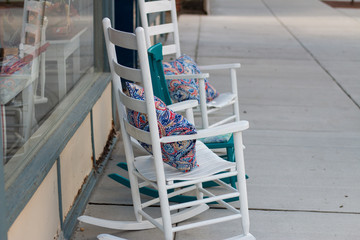 two chairs on the side walk