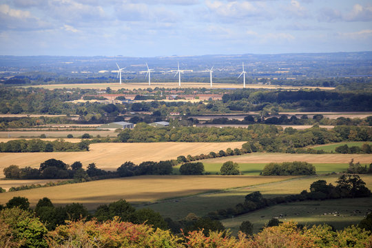 Wind turbines in English countryside on sunny day
