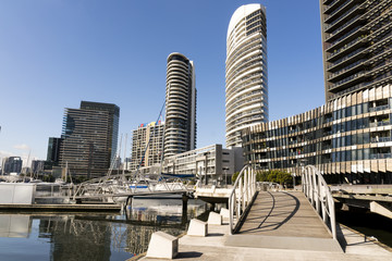 Docklands, Melbourne, Victoria, Australia. Waterfront buildings and marina, water and glass...