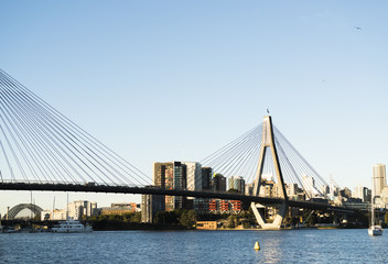 Peak hour on Anzac Bridge, Sydney, Australia. Water views to Sydney Harbour Bridge