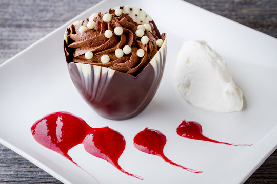 Chocolate Mousse in Chocolate Cup with Raspberry Sauce
