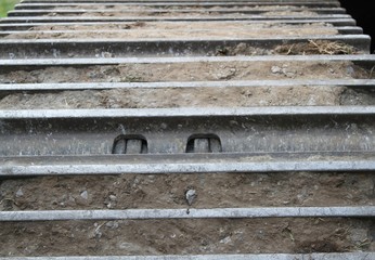 Close-up of steel undercarriage track of excavator