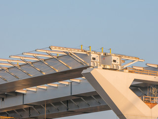 Fototapeta premium Major bridge construction site at the golden hour, Montreal, quebec, Canada.