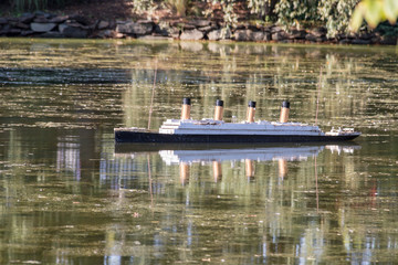 Titanic model in Halifax Public Gardens, water, reflection, calm, no people, summer day.