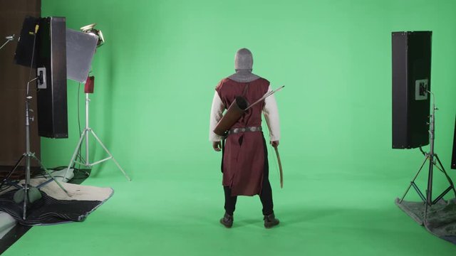 Warrior with bow and arrow on green screen set
