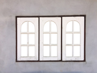 White wooden window for homes on the cement wall.