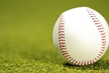 Baseball on neatly mowed grass