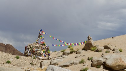 Tibetan Prayer Flags and Stone Heaps Existing Along the Sham Valley Trek in Ladakh, India 