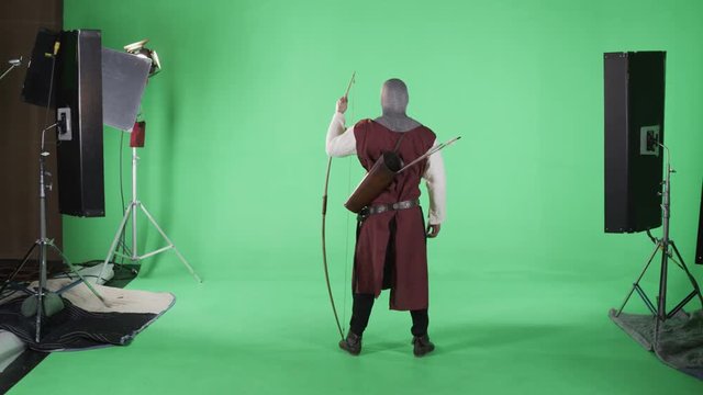 Green screen set with warrior holding bow and arrow