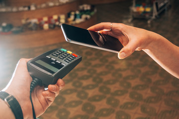 Terminal and smartphone during payment by NFC