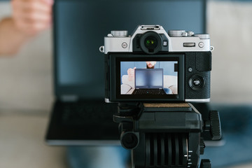 video content creation process. image of a man on a camera screen. shooting footage for blog...