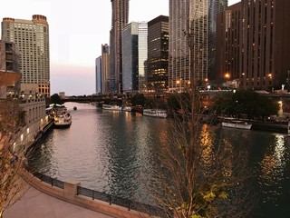 Fototapeta premium City and Skyscraper Views with Water Reflections Nearing Dusk in a Large Metropolis; Architecture, Business Travel, Personal Travel, Vacations, City Style Ideas