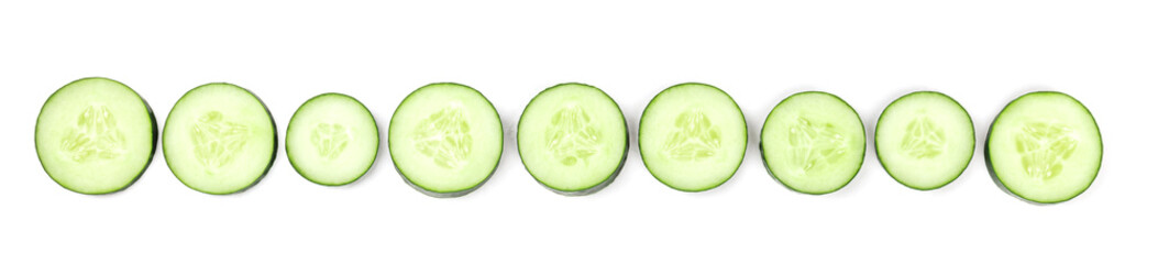 Cucumber slices forming a line on a white background with copyspace