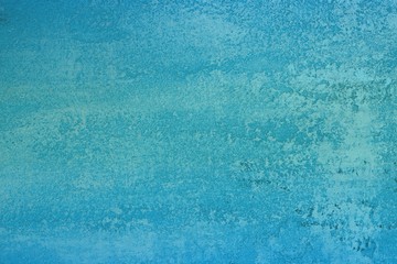 pretty aged light blue travertine like plaster texture for background use.