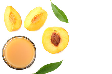 glass of peach juice with peach fruit, green leaf and slices isolated on white background. top view