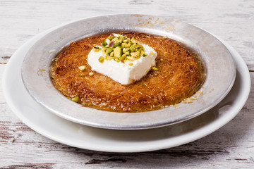 Delicious Traditional Turkish Dessert Kunefe with Pistachio and Cream