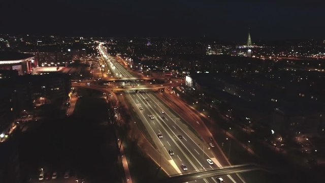 Night aerial view of highway traffic in Belgrade city.
