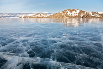 Winter morning on Baikal Lake. View from clear ice to the Mare's Head ( Kobylia Golova) Peninsula