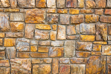 Colorful patterned surface of a stone wall.