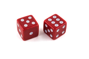 Two red dice close-up, isolated on white background, five and six