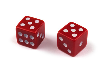 Two red dice closeup, isolated on white background, five and five