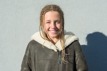 Close-up of an outdoor winter portrait of school girl 12,13 years old