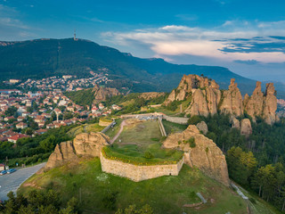Fototapeta na wymiar Amazing Belogradchik rock formation - natural phenomenon under the golden light of the setting sun - aerial shots of this popular tourist attraction on the Balkans