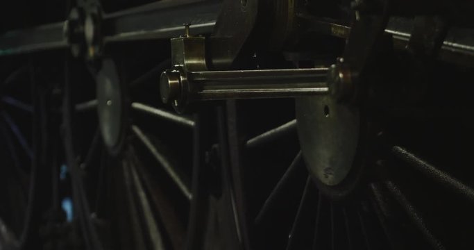 Close up of the train wheels that turn and run forward, wagon and carriage. Cponcetto of: travel, vintage.