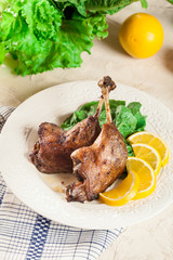 Duck legs confit with orange and salad