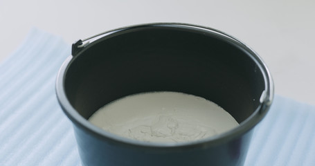 micro concrete plaster in a bucket