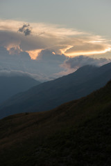 Obraz premium Cloudy sunset in the mountains of Valle de Aran