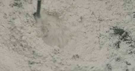 mixing hardener in micro concrete plaster