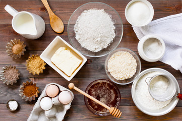 Ingredients for traditional gingerbread on the rustic wooden table