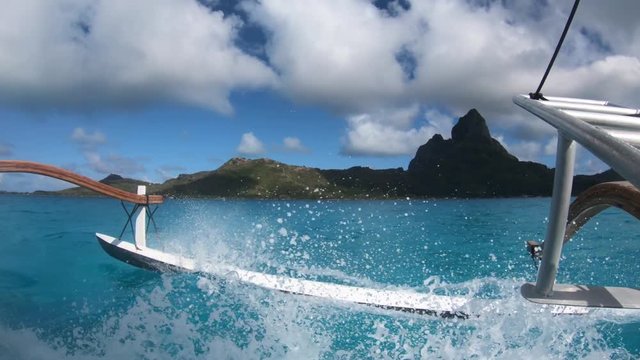 Sailing around blue lagoon and Otemanu mountain at Bora Bora island, Tahiti, French Polynesia (view from action camera)
