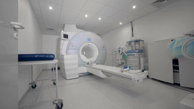 A tomography machine in modern clinic. CT scanner. Radiology equipment.