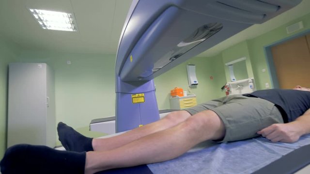 Tomography machine works on a patient. MRI, CT, PET scanner working.