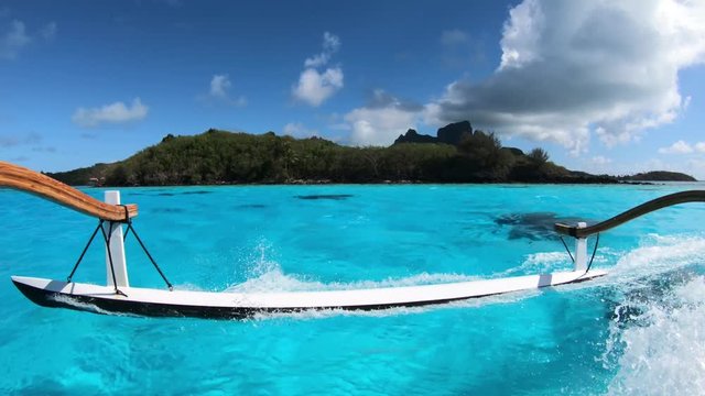 Sailing around blue lagoon and Otemanu mountain at Bora Bora island, Tahiti, French Polynesia (view from action camera)
