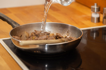 Meat being cooked on a pan