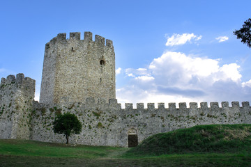 The stone tower and the wall of a castle