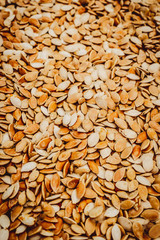 Raw pumpkin seeds background for design