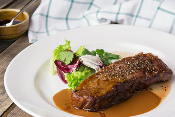meat steak with salad on a plate